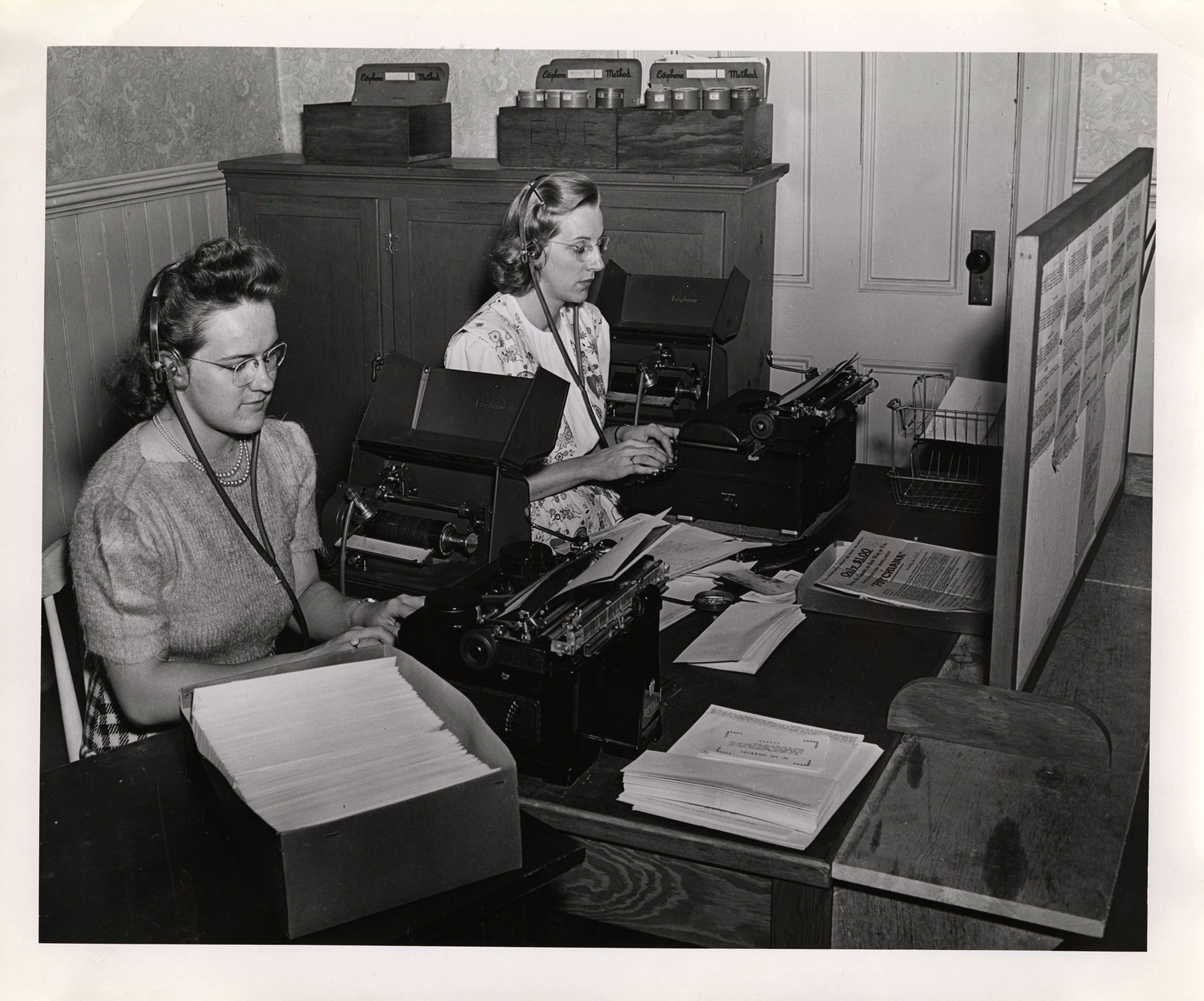 Photograph of two women using dictaphones